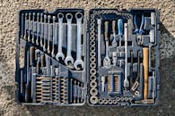 Flat lay of an organized toolbox with a variety of essential hand tools.